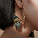 Fülbevalók hímzett pillangószárnyakkal